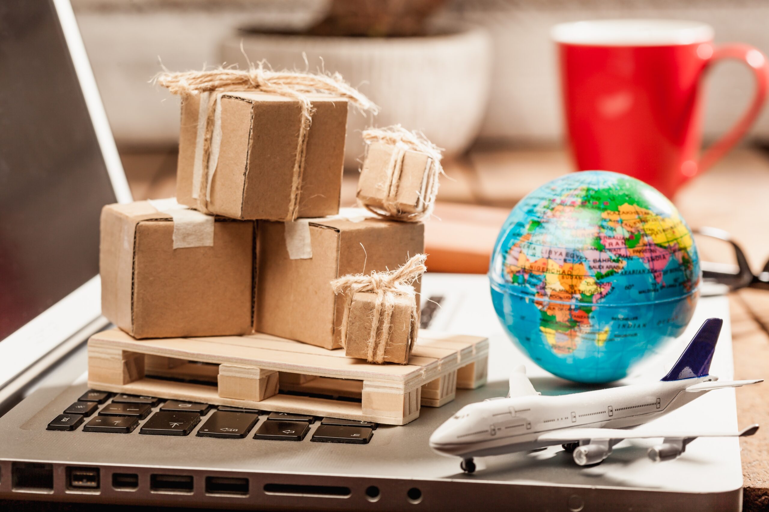 Global logistics concept with online trading and shopping in the internet, packages to be delivered after ordering on the computer